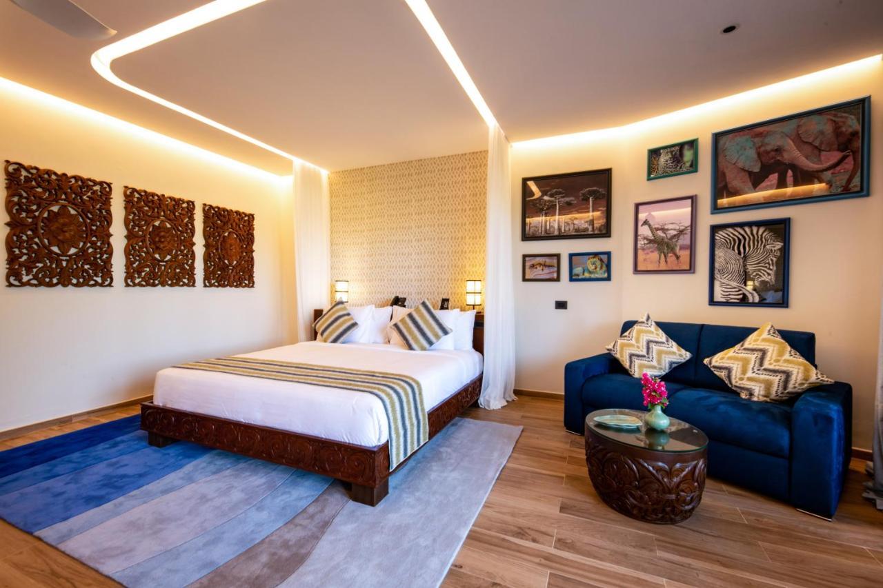 فندق The Mora Zanzibar ماتيموي المظهر الخارجي الصورة A bedroom at the hotel
